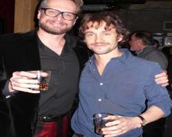 Hugh Dancy consuming alcohol